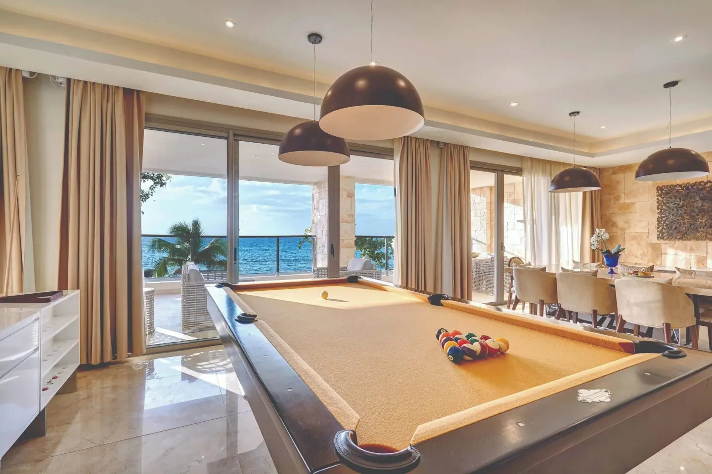 Oceanfront game room with pool table in a suite at Royalton Hideaway Saint Lucia.