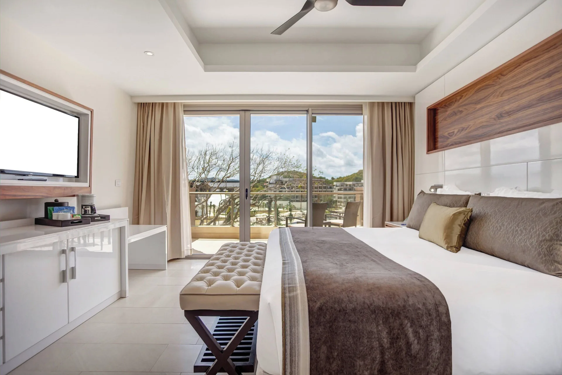 Luxury Family Suite Ocean View Diamond Club king bed facing balcony at Royalton Hideaway Saint Lucia.