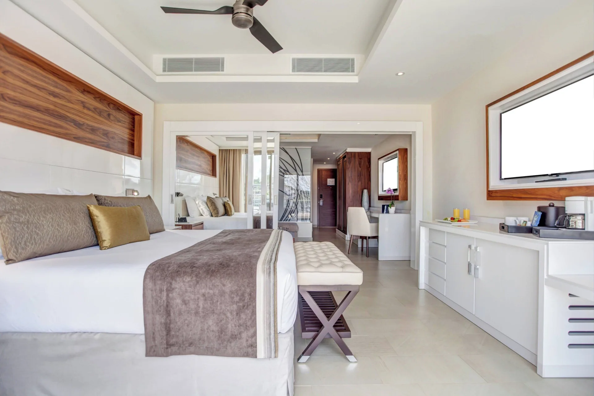 Luxury Family Suite Ocean View Diamond Club bedroom with TV wall at Royalton Hideaway Saint Lucia.