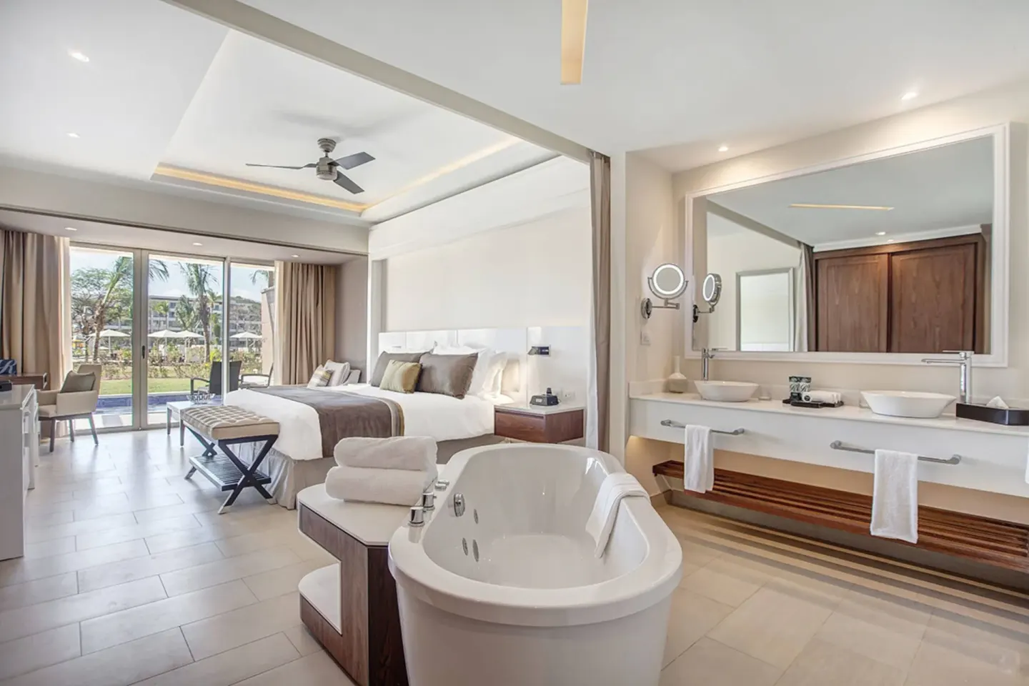 Luxury Junior Suite with king bed, soaking tub and open vanity at Royalton Hideaway Saint Lucia.