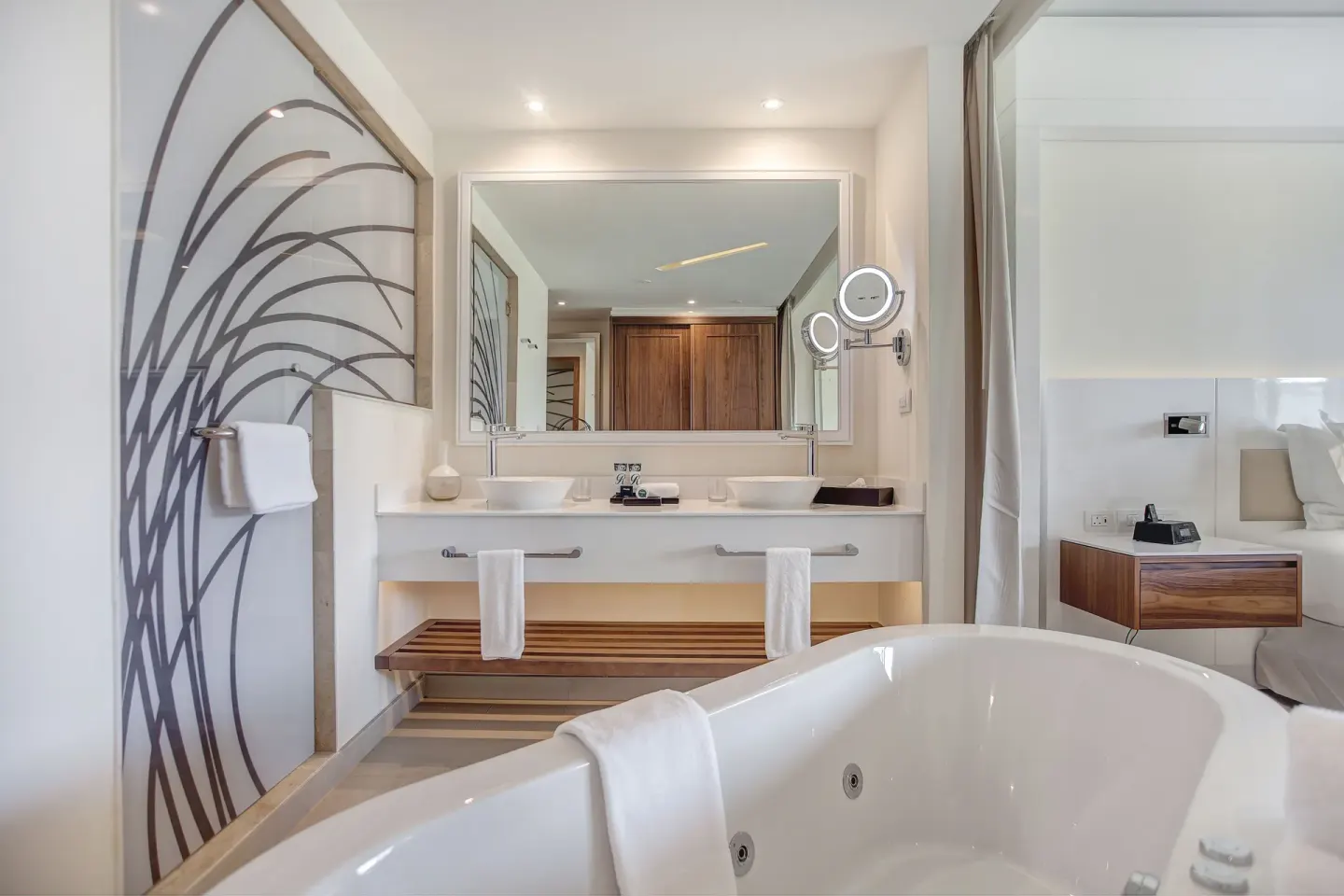 Luxury Junior Suite bathroom with soaking tub and double vanity at Royalton Hideaway Saint Lucia.