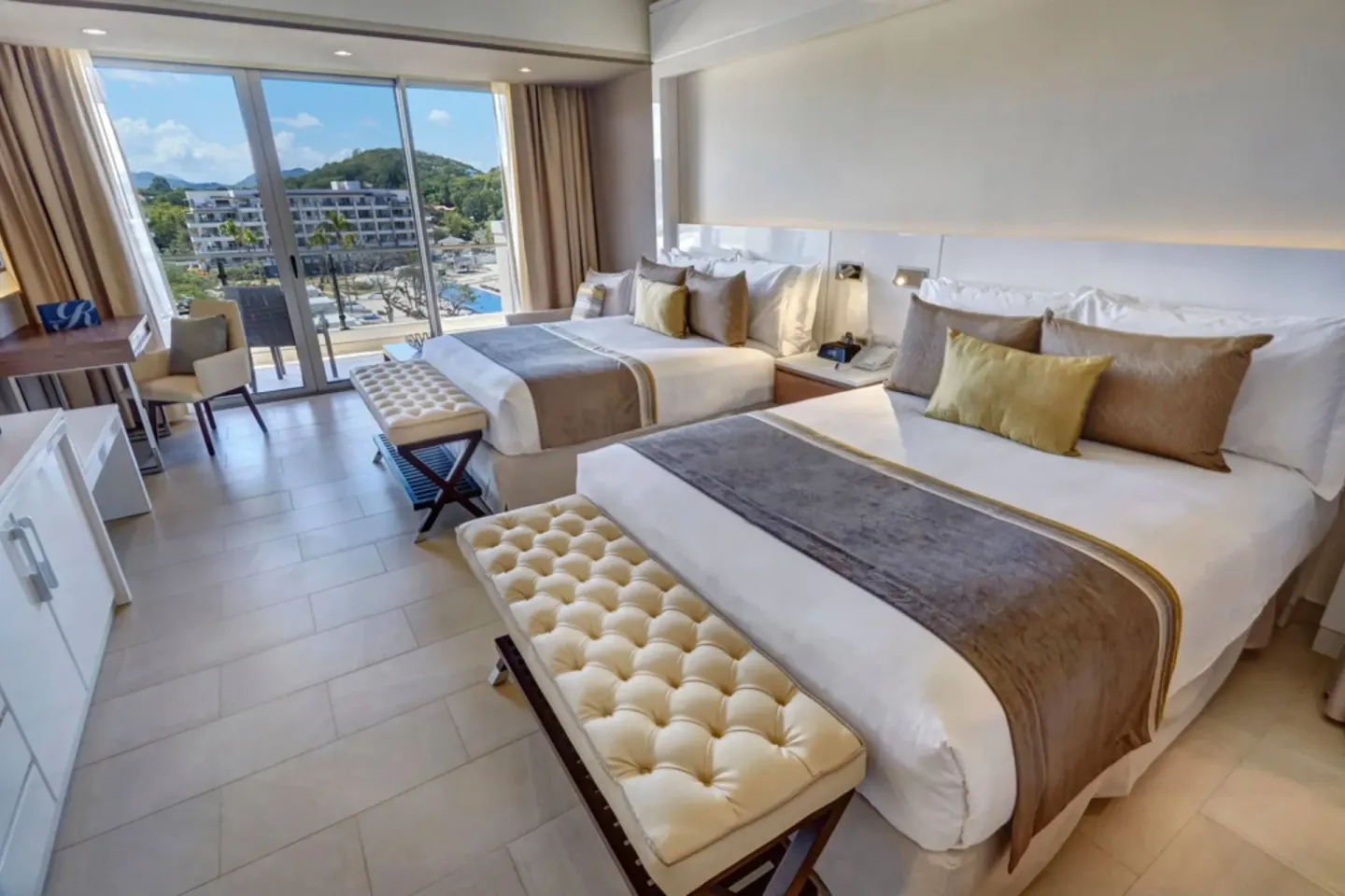 Luxury Junior Suite with two beds and balcony view at Royalton Hideaway Saint Lucia.