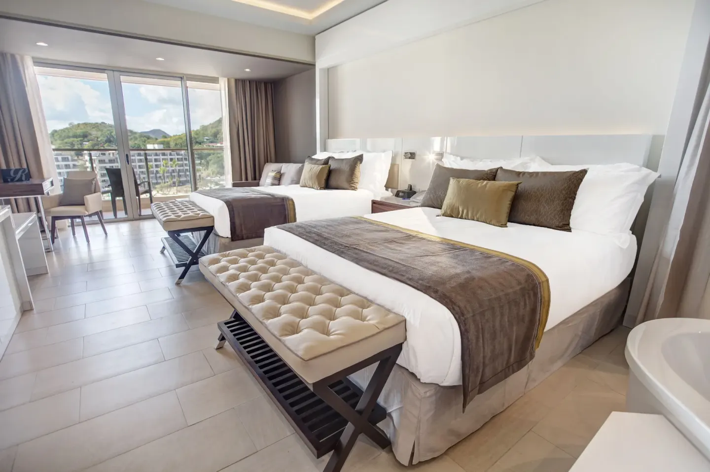 Luxury Junior Suite with two beds and balcony view at Royalton Hideaway Saint Lucia.