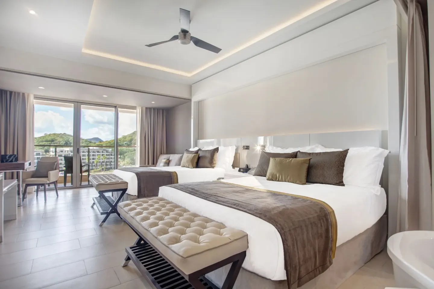 Luxury Junior Suite two-bed room with ceiling fan at Royalton Hideaway Saint Lucia.