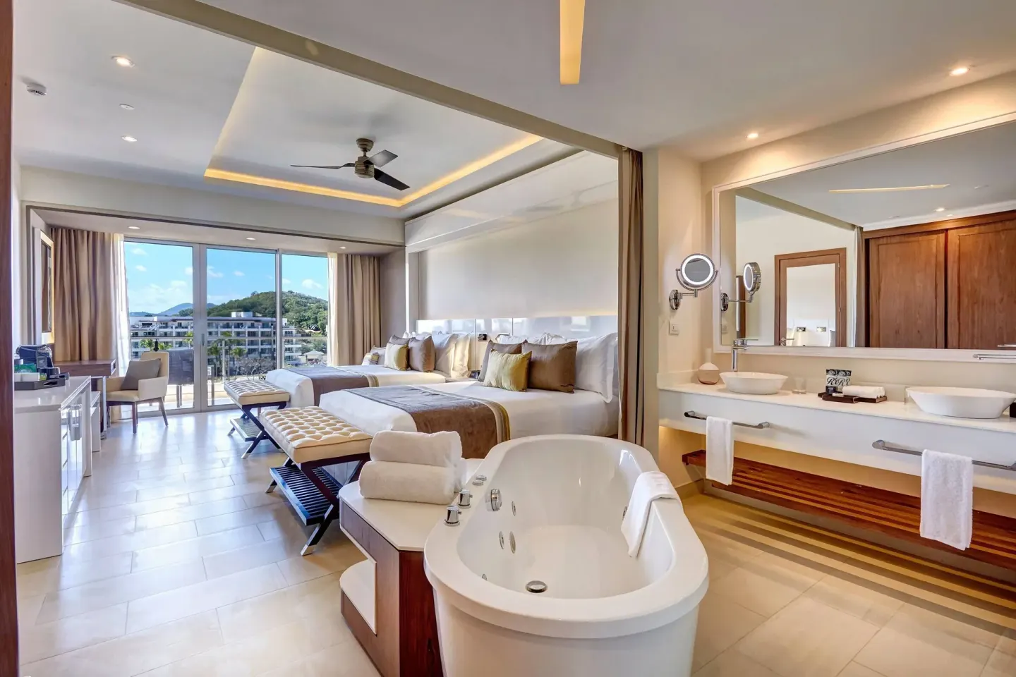 Luxury Junior Suite with two beds, soaking tub and balcony at Royalton Hideaway Saint Lucia.