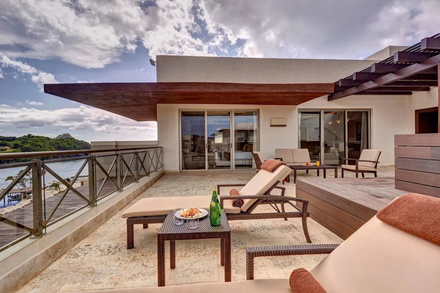 Private terrace with loungers and ocean view at Royalton Hideaway Saint Lucia.