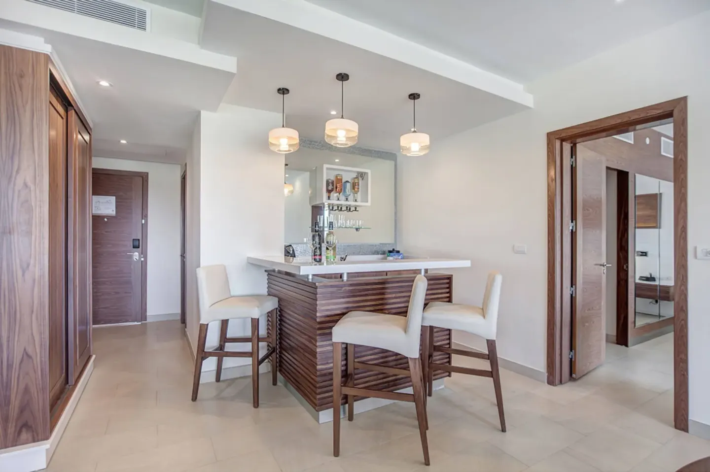 Luxury Presidential suite bar area with stools at Royalton Hideaway Saint Lucia.