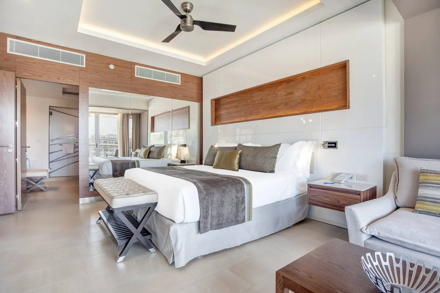 Luxury Presidential one bedroom king bed and seating at Royalton Hideaway Saint Lucia.