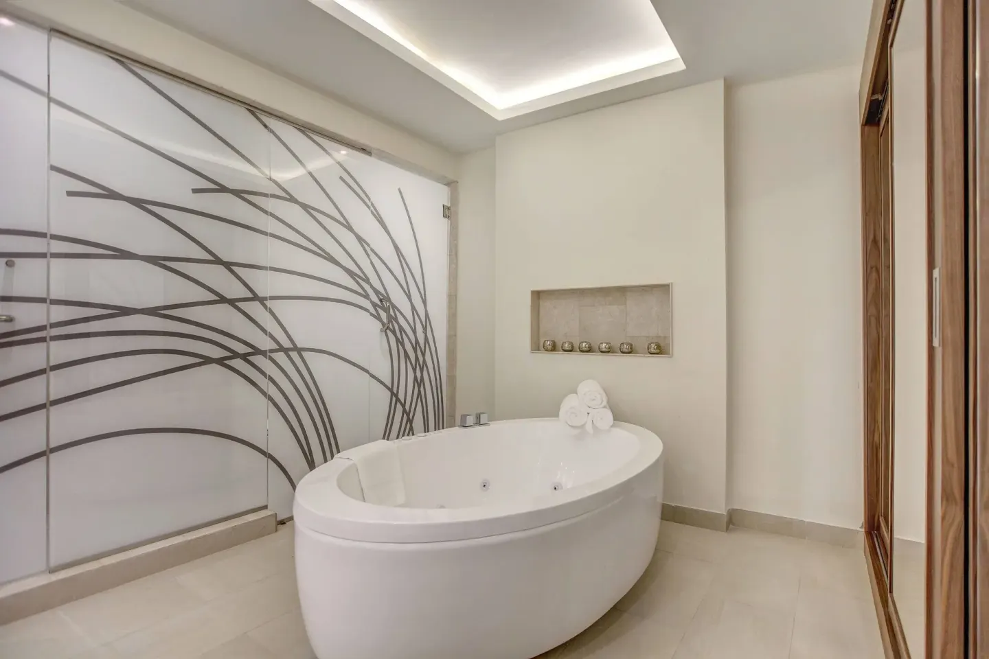 Bathroom with soaking tub in a Presidential One Bedroom Ocean View suite at Royalton Hideaway Saint Lucia.