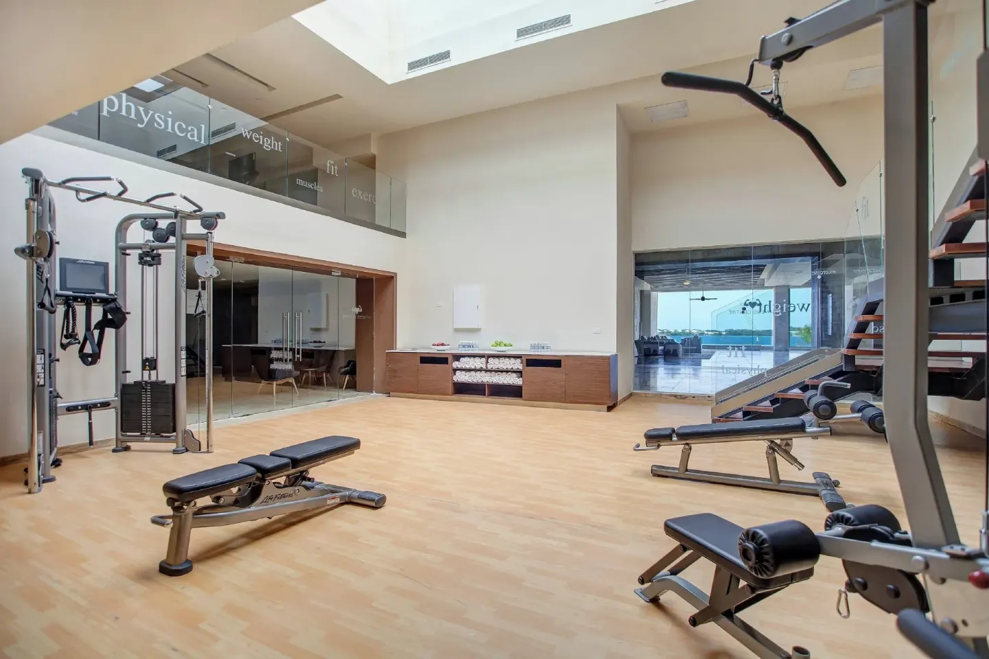 Fitness center with cable machines and benches at Royalton Negril.