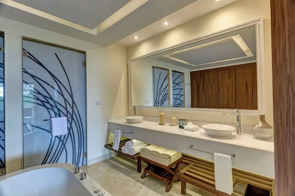 Oceanfront suite bathroom with soaking tub and double vanity at Royalton Negril.