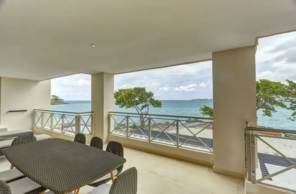 Oceanfront suite terrace dining area overlooking the sea at Royalton Negril.