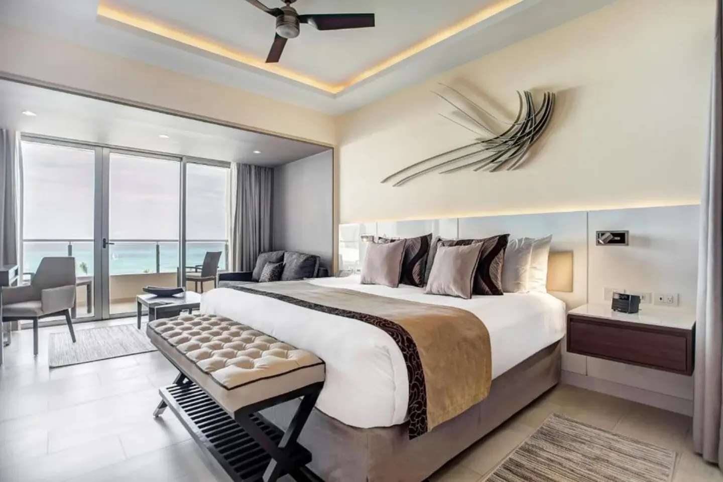 Luxury Family Suite Ocean View bedroom with king bed and balcony at Royalton Negril.