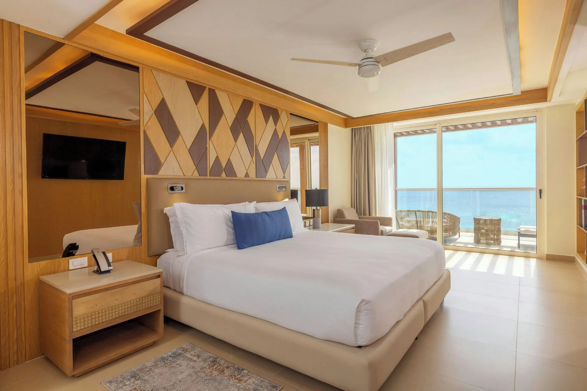 King guest room with balcony and ocean view at Royalton Splash Riviera Cancun.