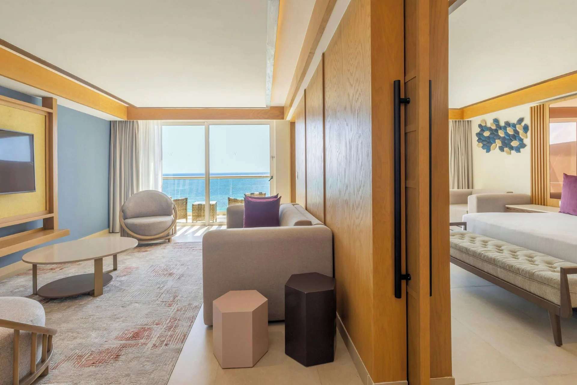 Ocean-view suite living area and bedroom at Royalton Splash Riviera Cancun.