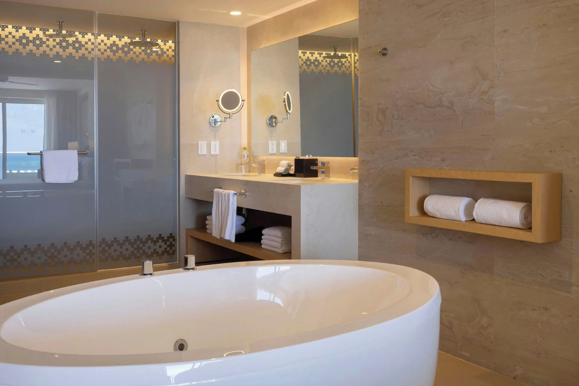 Bathroom with freestanding tub, shower and double vanity at Royalton Splash Riviera Cancun.