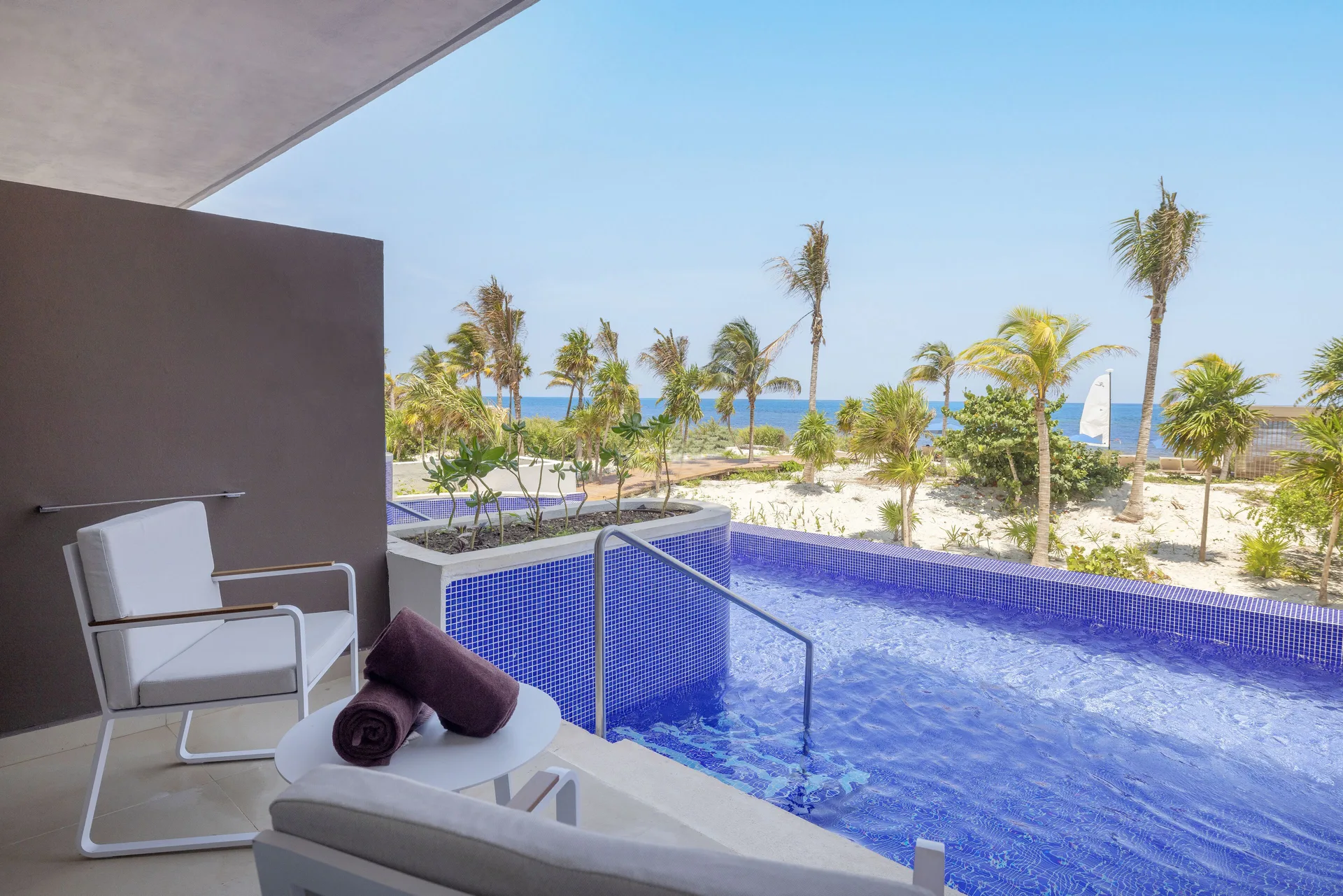 Private terrace with swim-out pool and ocean view at Royalton Splash Riviera Cancun.