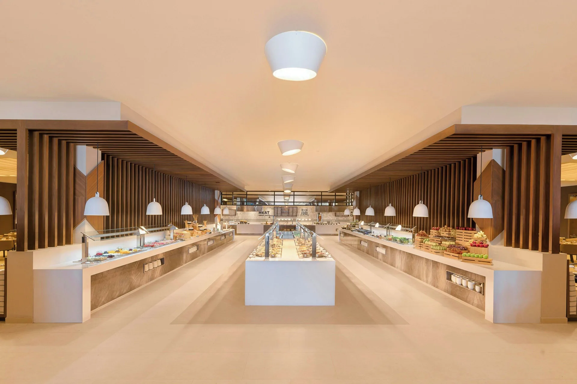 Buffet restaurant at Royalton Splash Riviera Cancun with display counters and pendant lights.