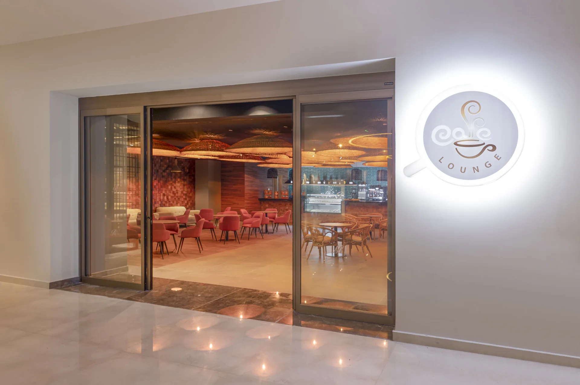Caffe Lounge entrance and seating area at Royalton Splash Riviera Cancun.