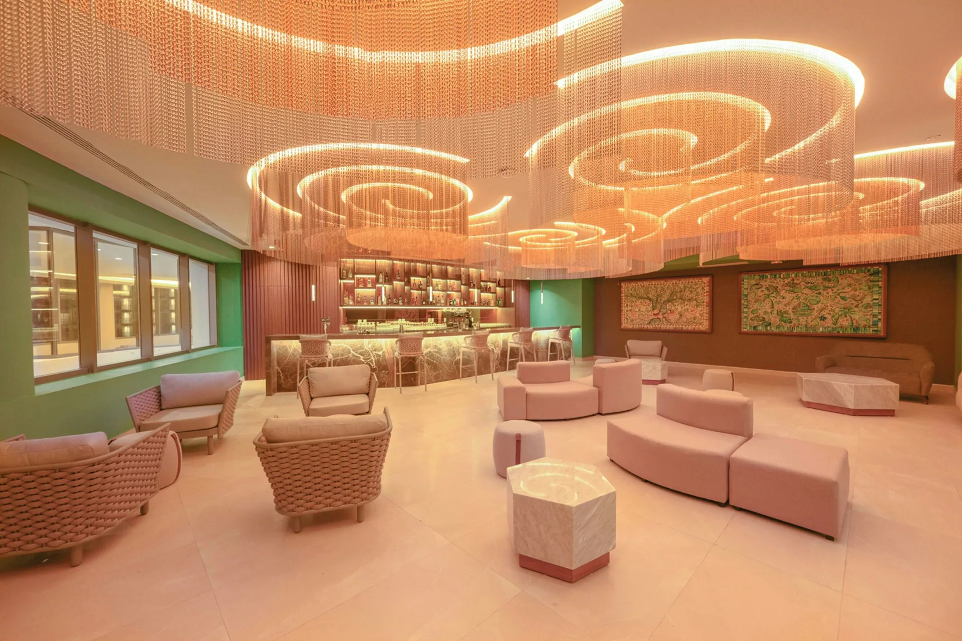 Lounge seating and illuminated bar area at Royalton Splash Riviera Cancun.