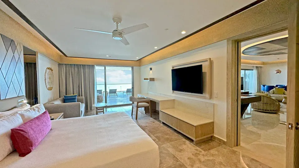 Bedroom with oceanfront balcony in the Chairman Two Bedroom Suite at Royalton Splash Riviera Cancun.