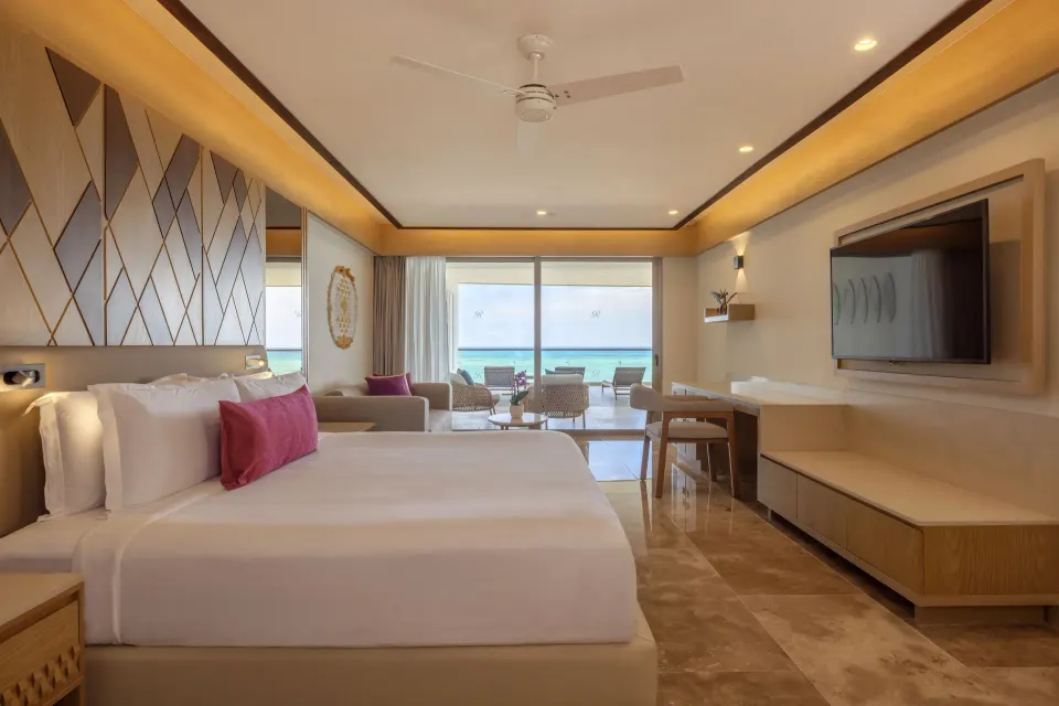 King bedroom with balcony ocean view in the Chairman Two Bedroom Suite at Royalton Splash Riviera Cancun.