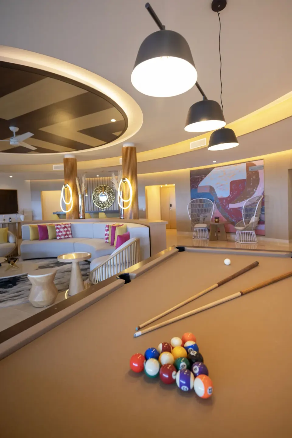 Suite game area with billiards table and lounge beyond at Royalton Splash Riviera Cancun.