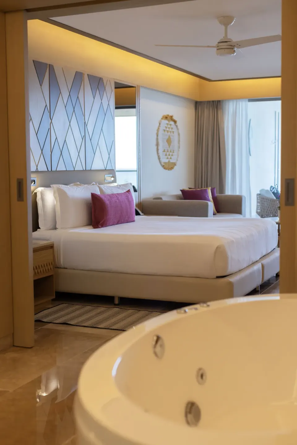 King bedroom and whirlpool tub in a Chairman suite at Royalton Splash Riviera Cancun.