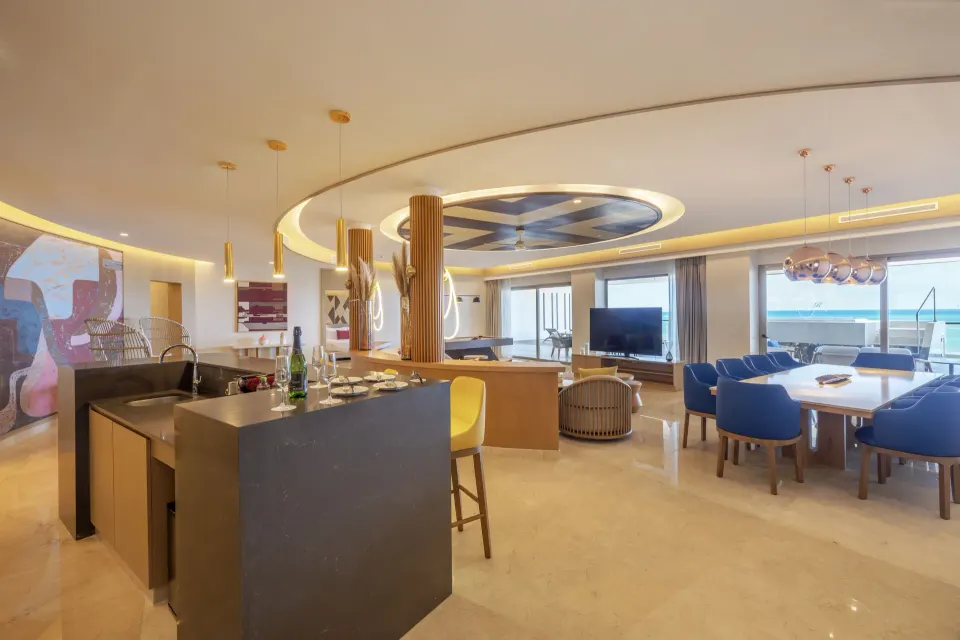 Open living and dining area of an oceanfront suite at Royalton Splash Riviera Cancun.