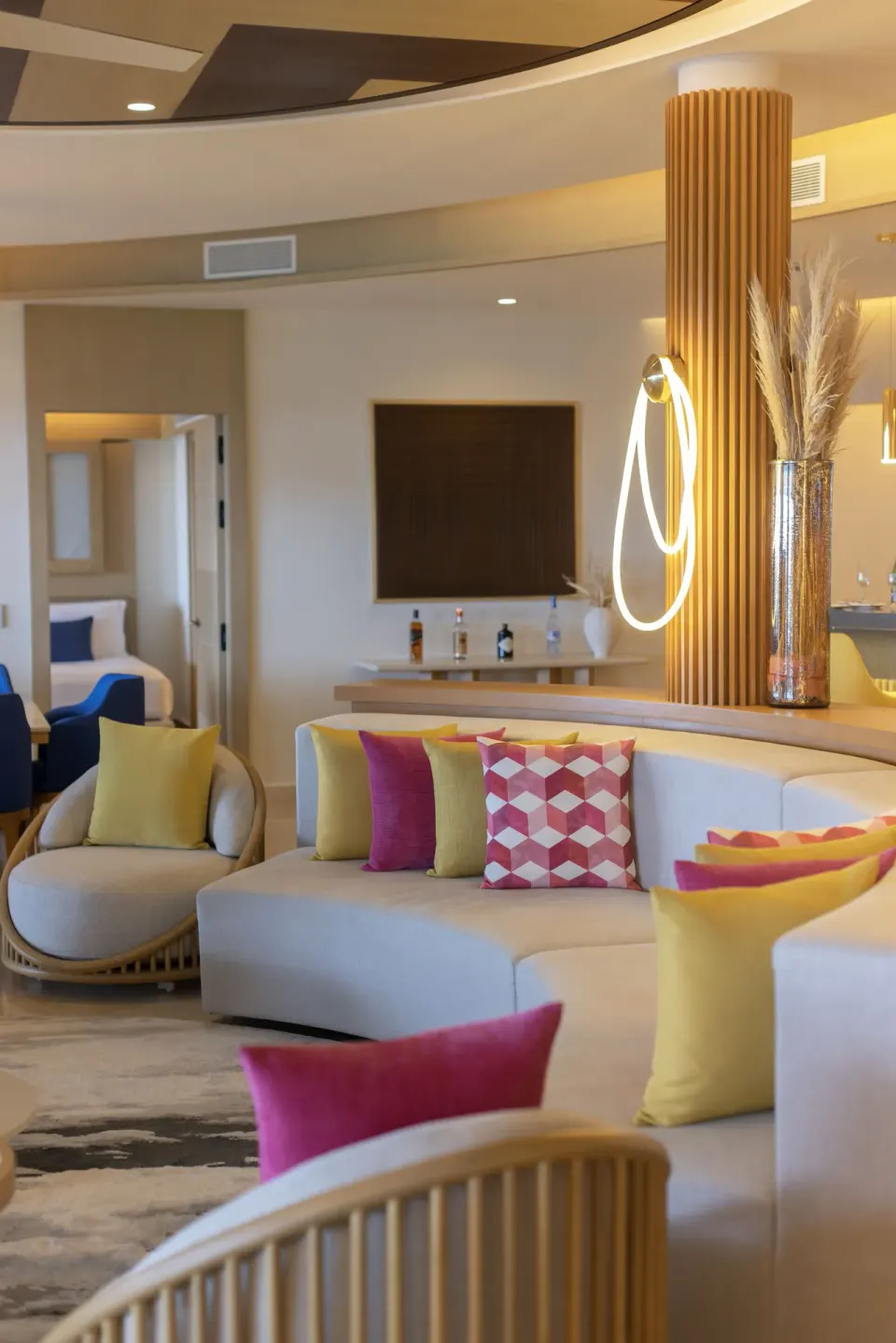 Colorful lounge seating in a Chairman suite at Royalton Splash Riviera Cancun.