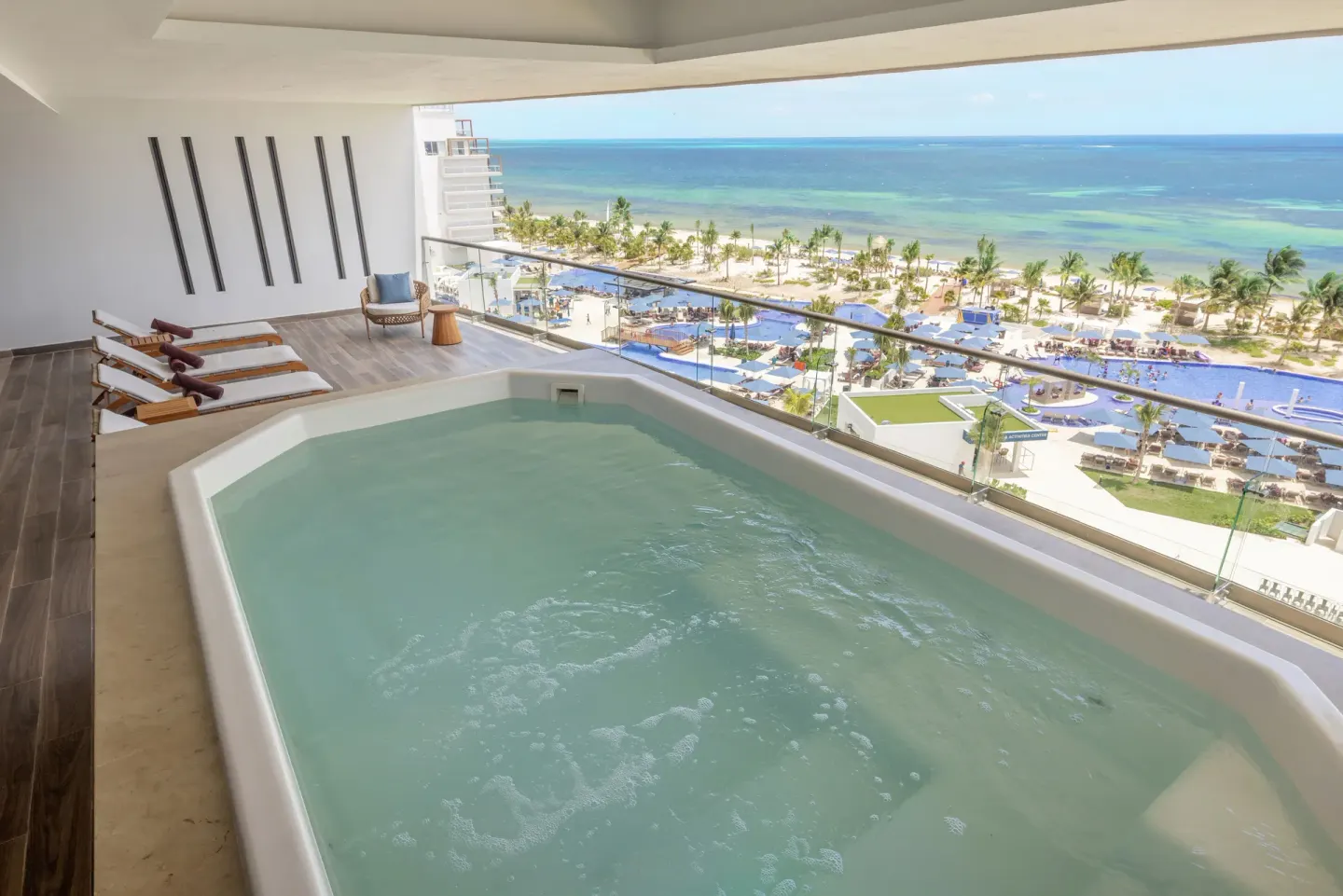 Suite plunge pool with beach and resort pools beyond at Royalton Splash Riviera Cancun.