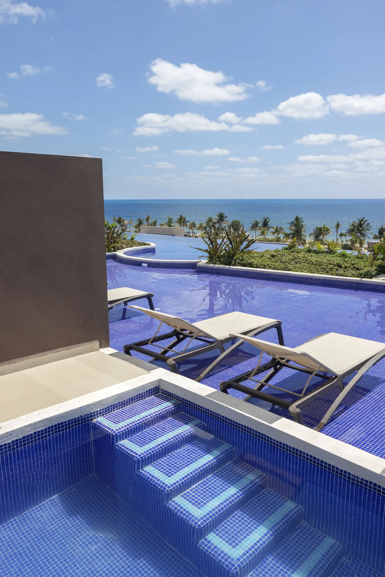 Private swim-out plunge pool with loungers and ocean view at Royalton Splash Riviera Cancun.