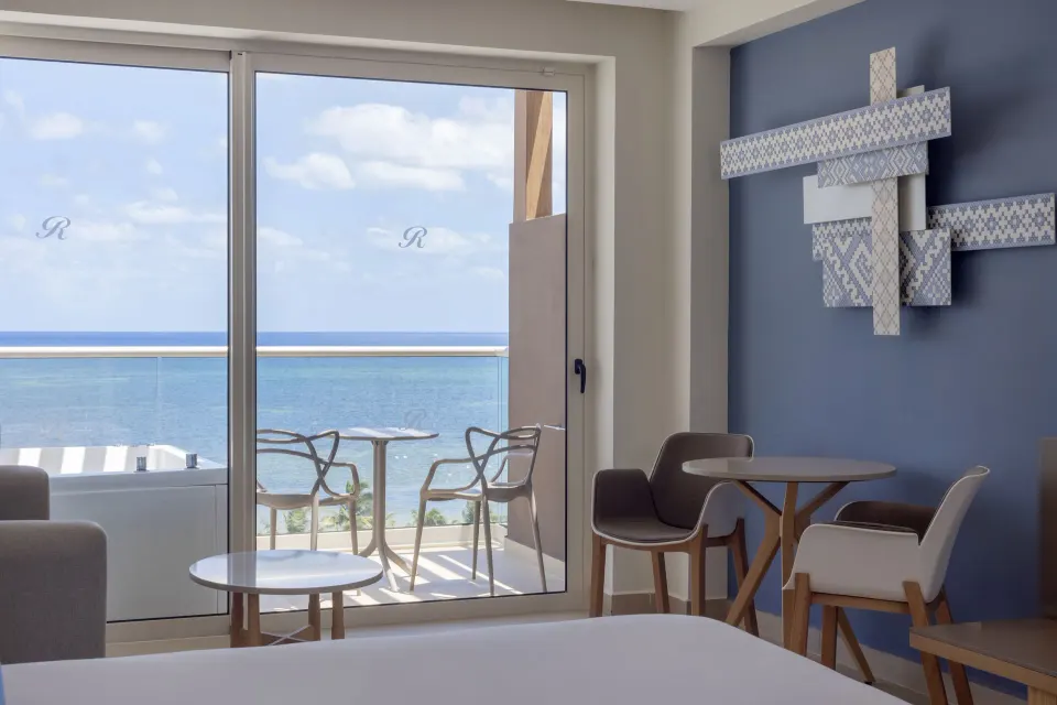 Oceanfront suite seating area and terrace Jacuzzi at Royalton Splash Riviera Cancun.