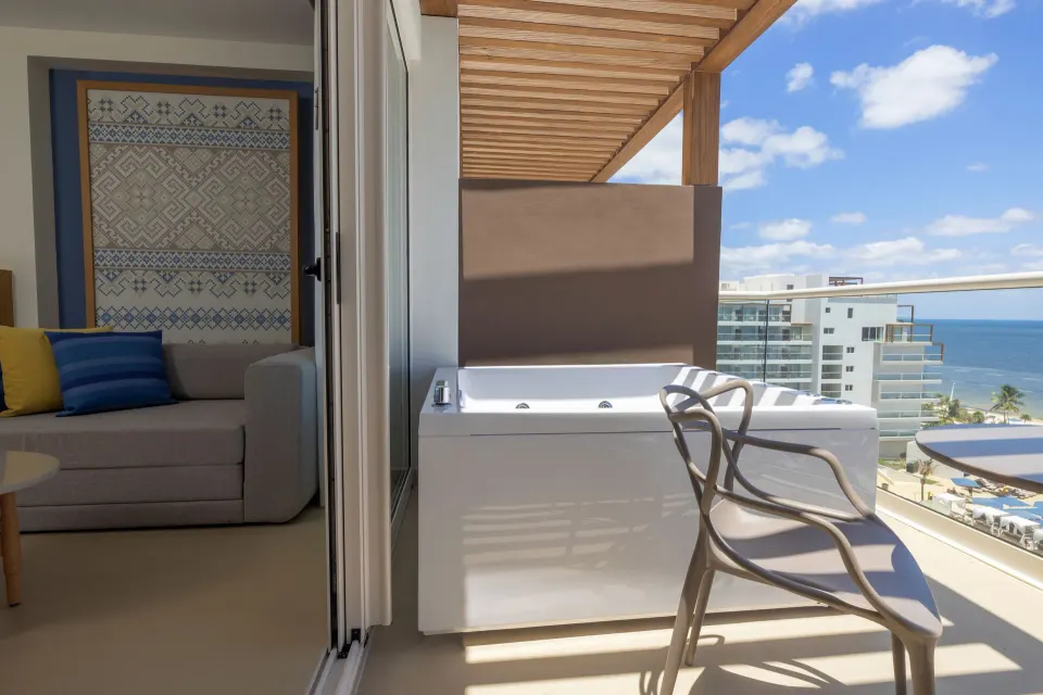 Suite terrace Jacuzzi beside the sitting area at Royalton Splash Riviera Cancun.