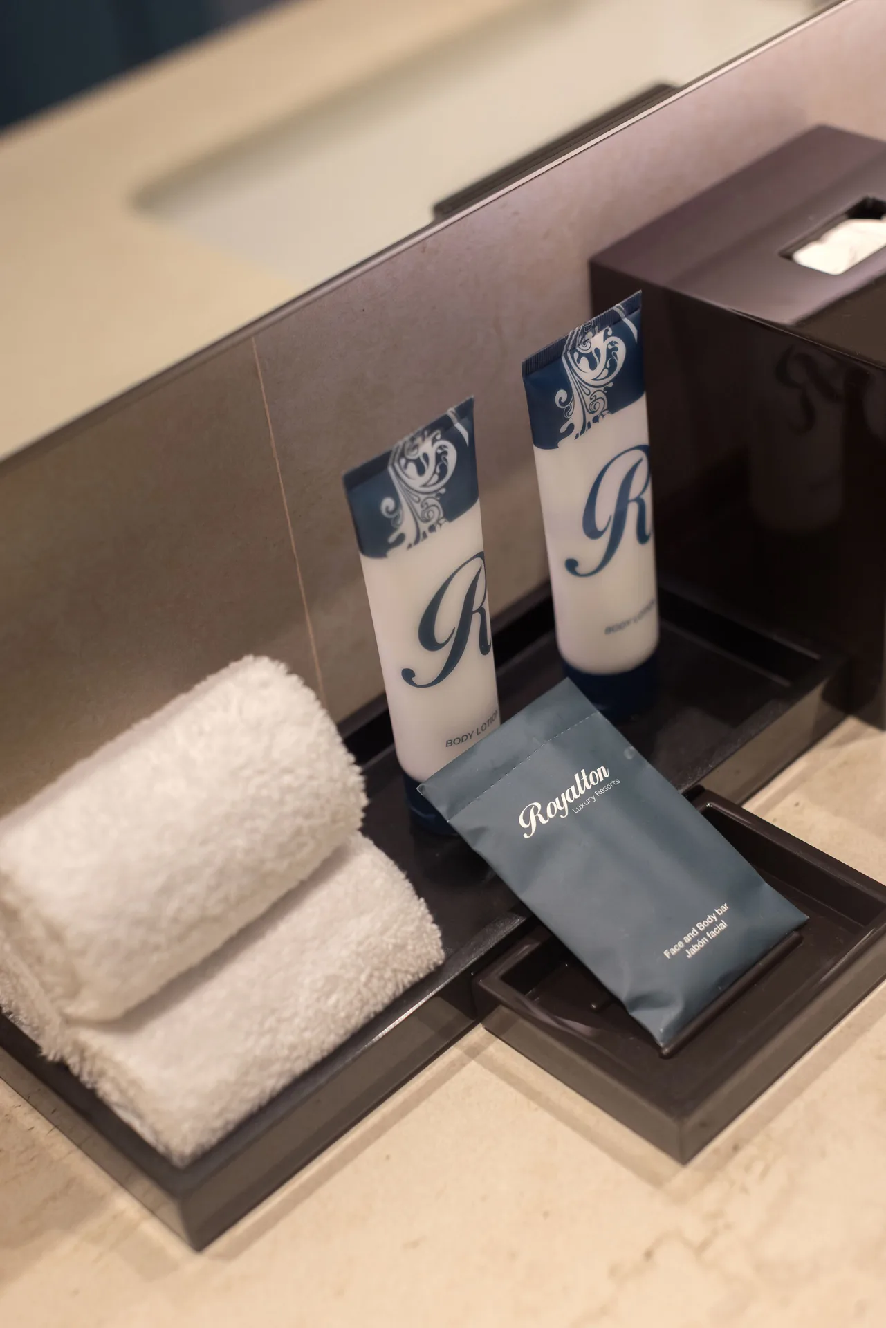 Bathroom towels and bath amenities in a Luxury Junior Suite at Royalton Splash Riviera Cancun.