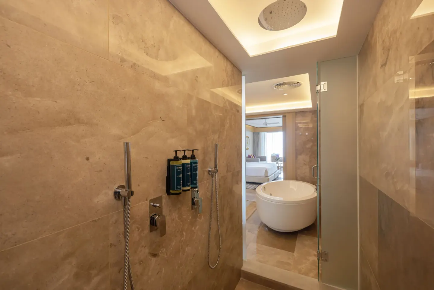 Marble shower and freestanding tub in a Luxury Junior Suite Swim Out Diamond Club at Royalton Splash Riviera Cancun.
