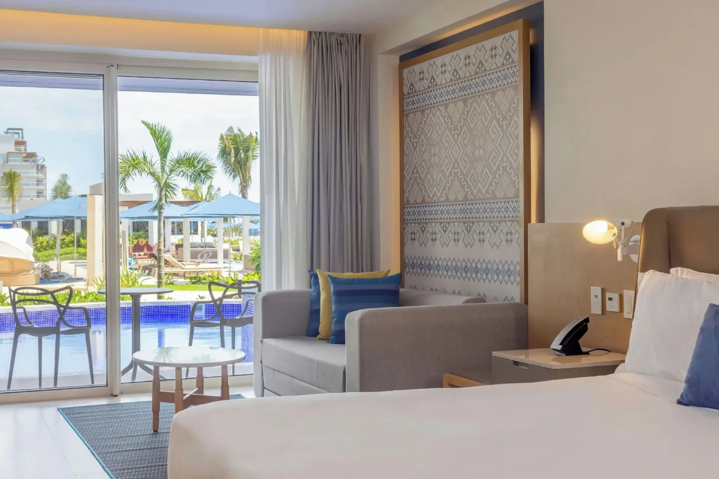 Luxury Junior Suite Swim Out with king bed and terrace at Royalton Splash Riviera Cancun.