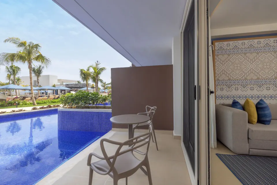 Luxury Junior Suite Swim Out patio beside the pool at Royalton Splash Riviera Cancun.