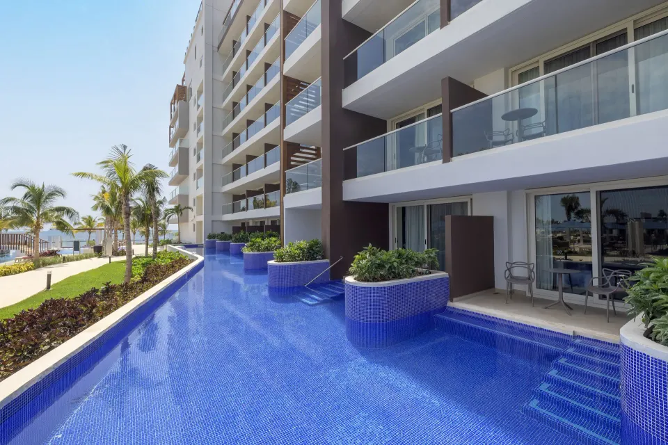 Luxury Junior Suite Swim Out terraces and pool steps at Royalton Splash Riviera Cancun.