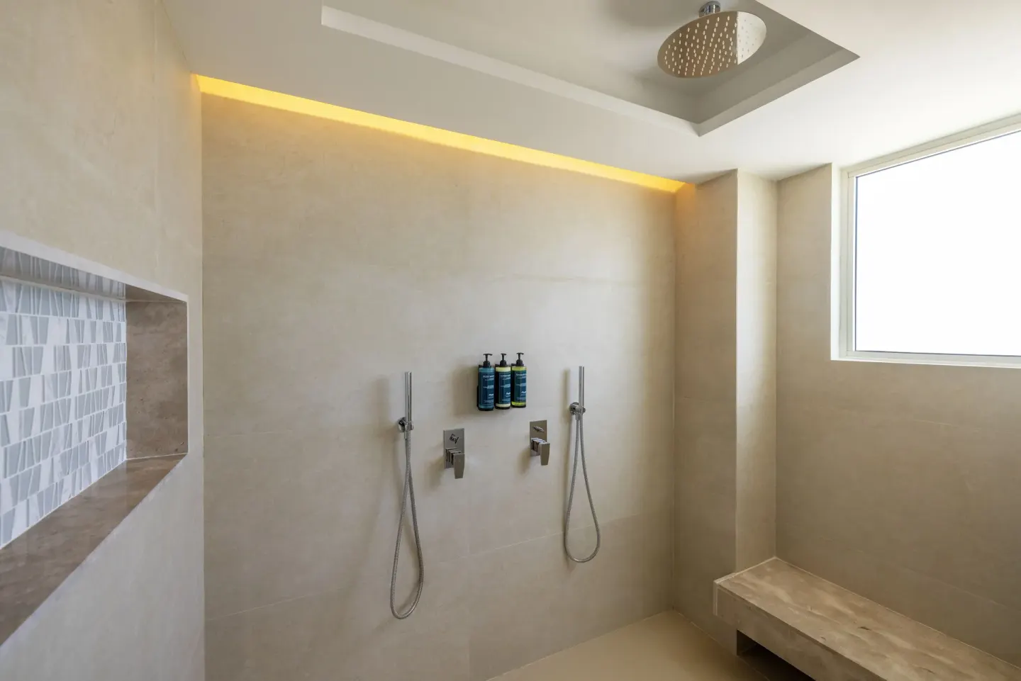 Walk-in rain shower in a Luxury Junior Suite Swim Out at Royalton Splash Riviera Cancun.