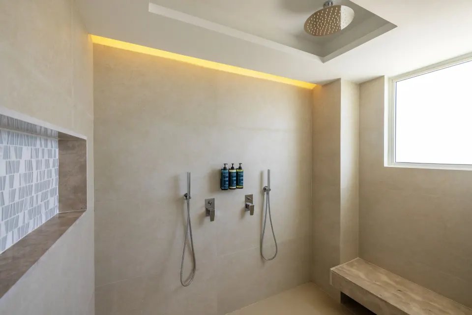 Walk-in rain shower in a Luxury Junior Suite Swim Out at Royalton Splash Riviera Cancun.