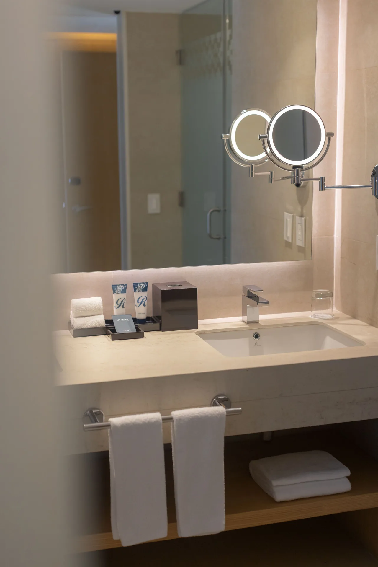 Luxury Junior Suite bathroom vanity with mirror at Royalton Splash Riviera Cancun.