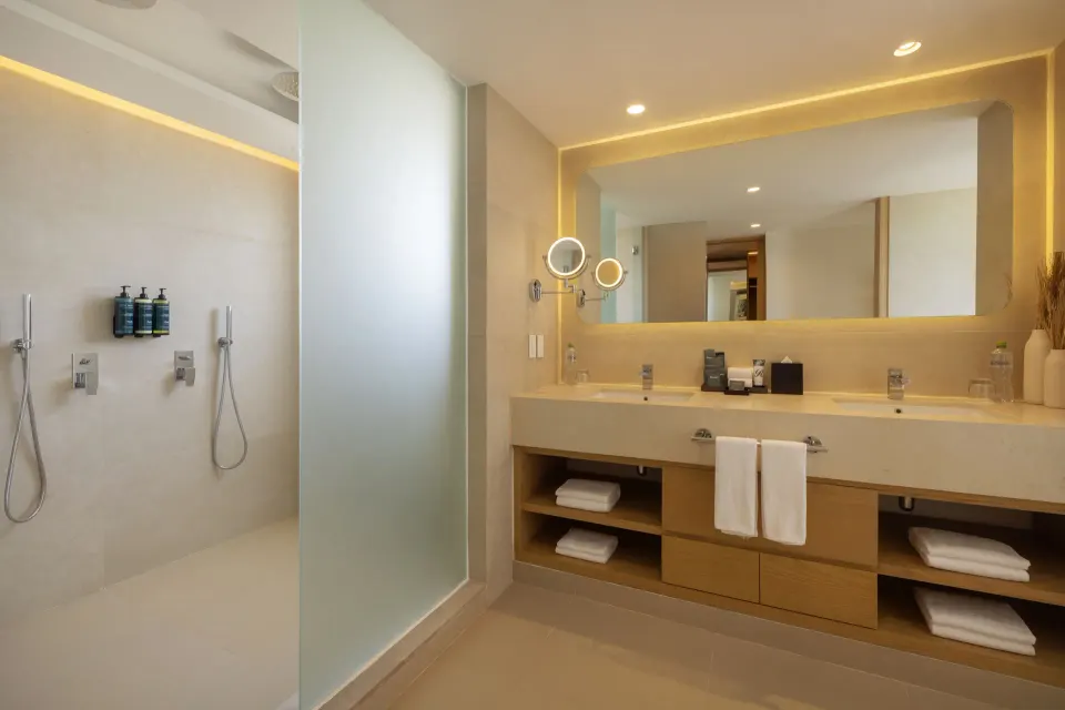 Luxury Junior Suite double vanity and shower area at Royalton Splash Riviera Cancun.
