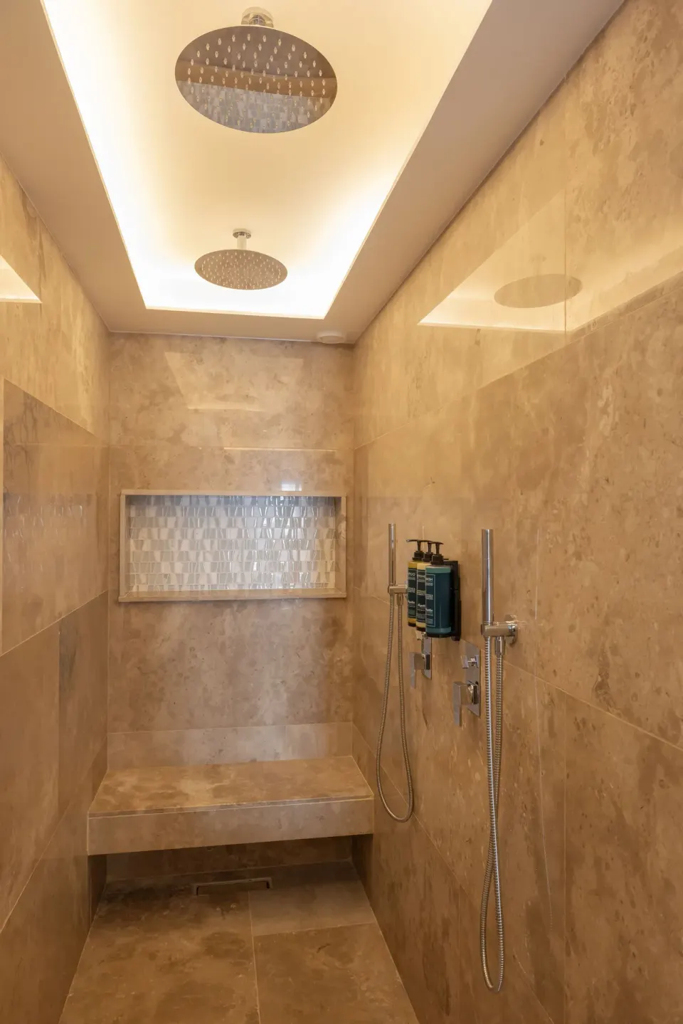 Walk-in shower in a Luxury Junior Suite bathroom at Royalton Splash Riviera Cancun.