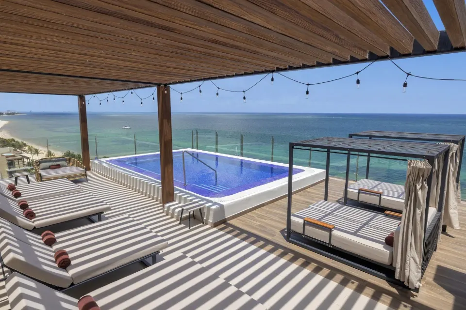 Private terrace pool with loungers and cabanas at Royalton Splash Riviera Cancun.