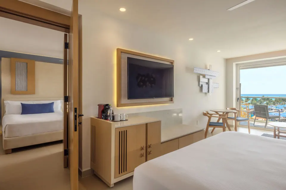 Two Bedroom Luxury Junior Suite with ocean-view balcony at Royalton Splash Riviera Cancun.
