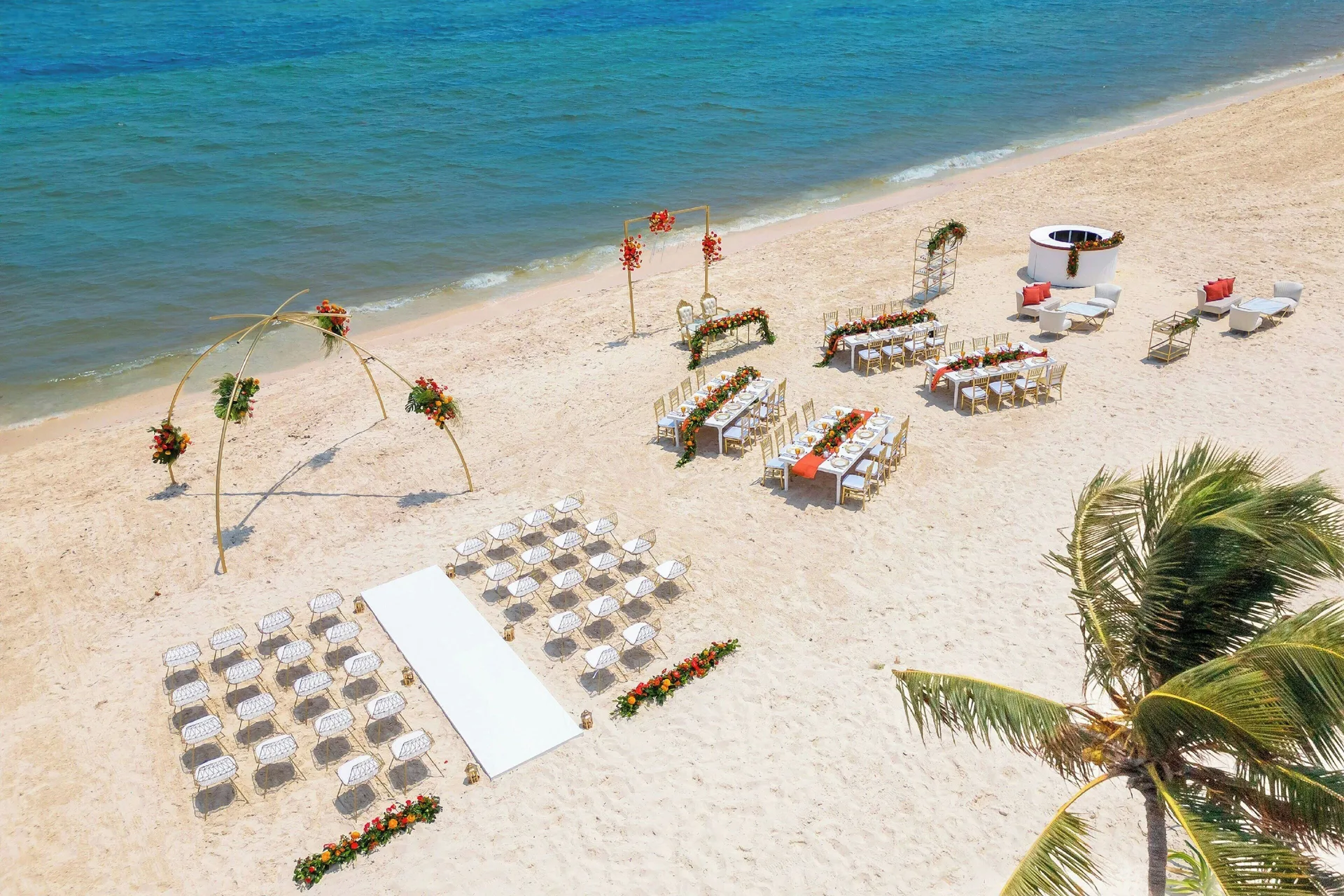 Beach wedding setup beside the Caribbean at Royalton Splash Riviera Cancun.