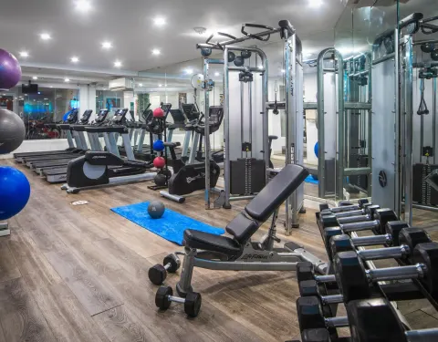 Fitness center with treadmills, weights and strength machines at S Hotel Montego Bay.