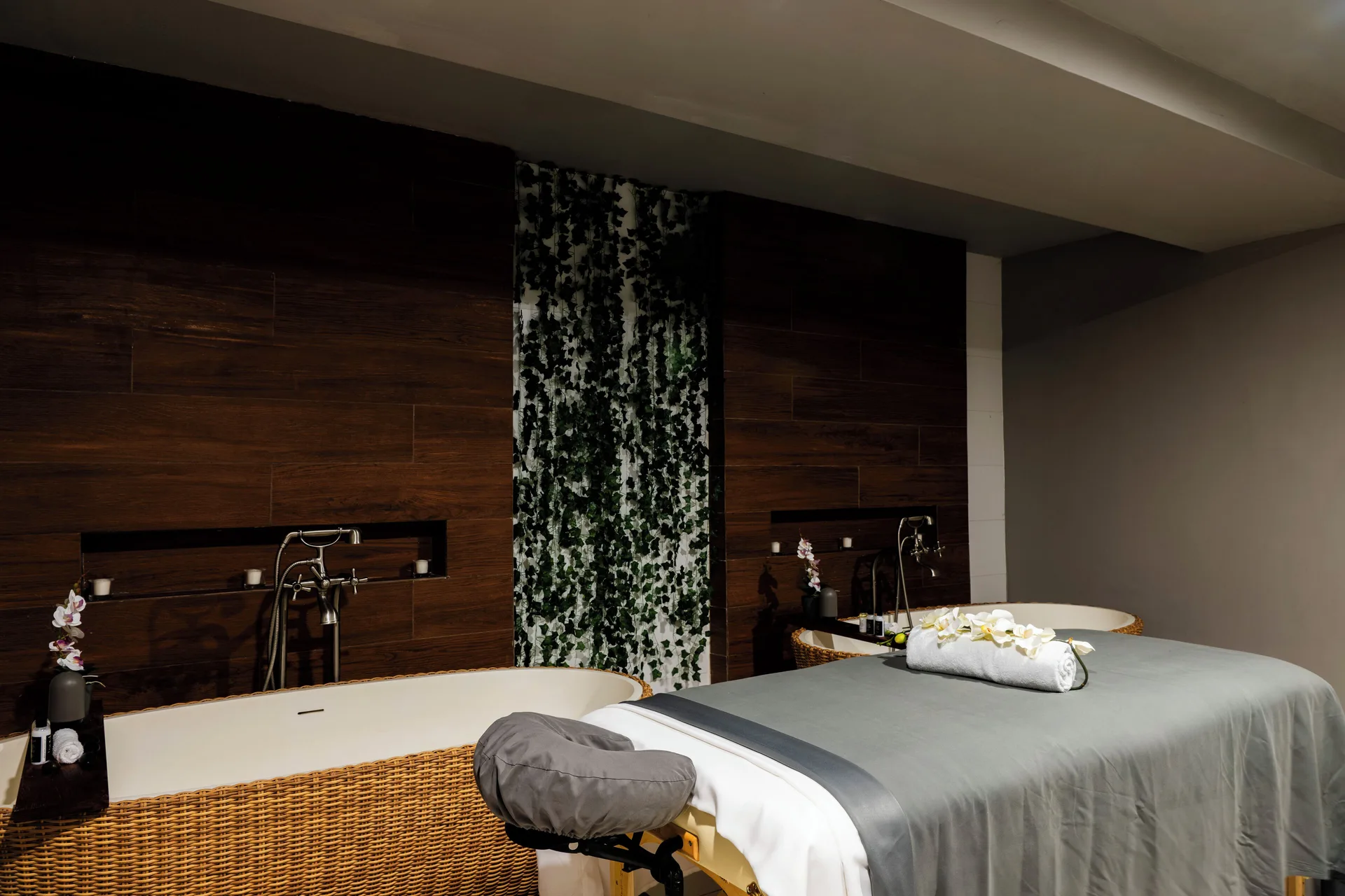 Spa treatment room with massage table and soaking tubs at S Hotel Montego Bay.