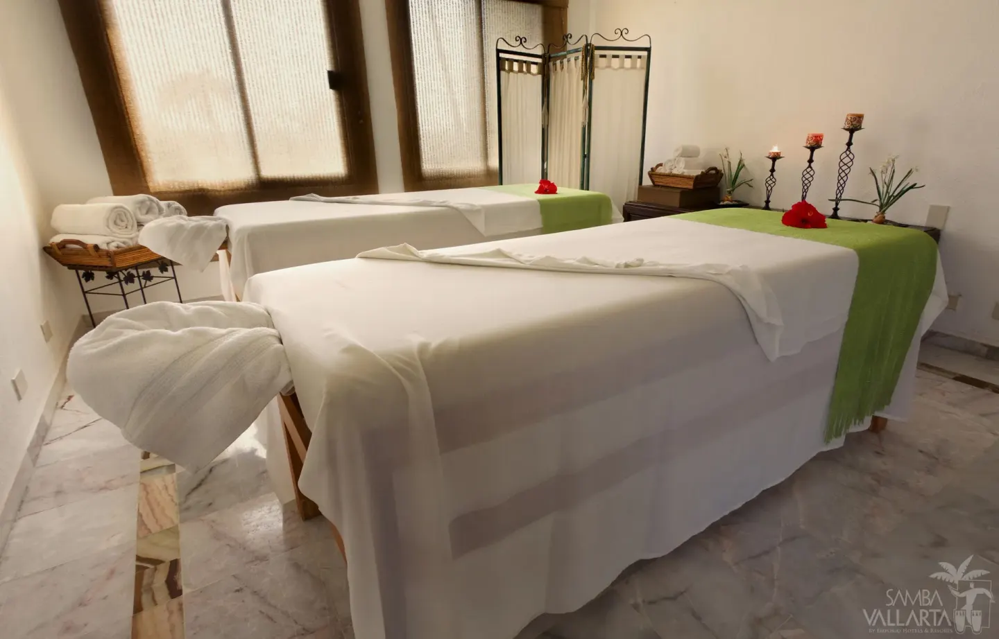 Spa treatment room with two massage tables at Samba Vallarta.